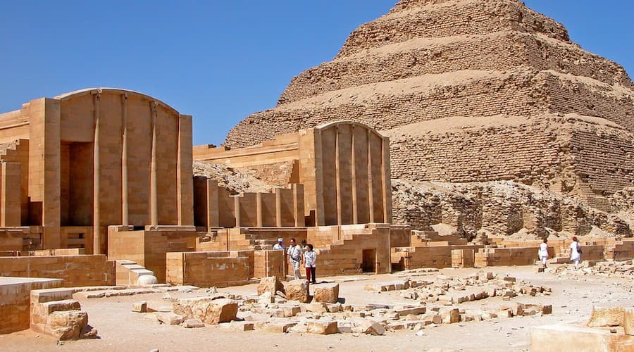 Front view of the Step Pyramid of Djoser at Saqqara with surrounding desert landscape